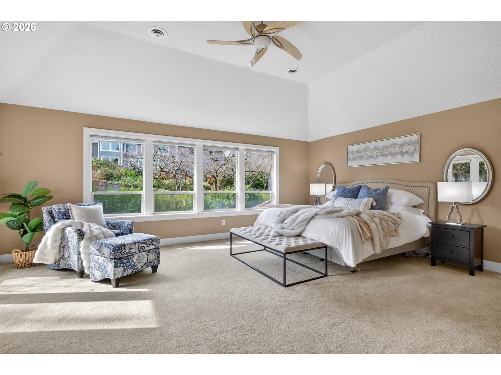 3390 Quail Ridge Court West Linn, OR 97068 - Photo 25 of 48 a spacious bedroom with a bed couch and window