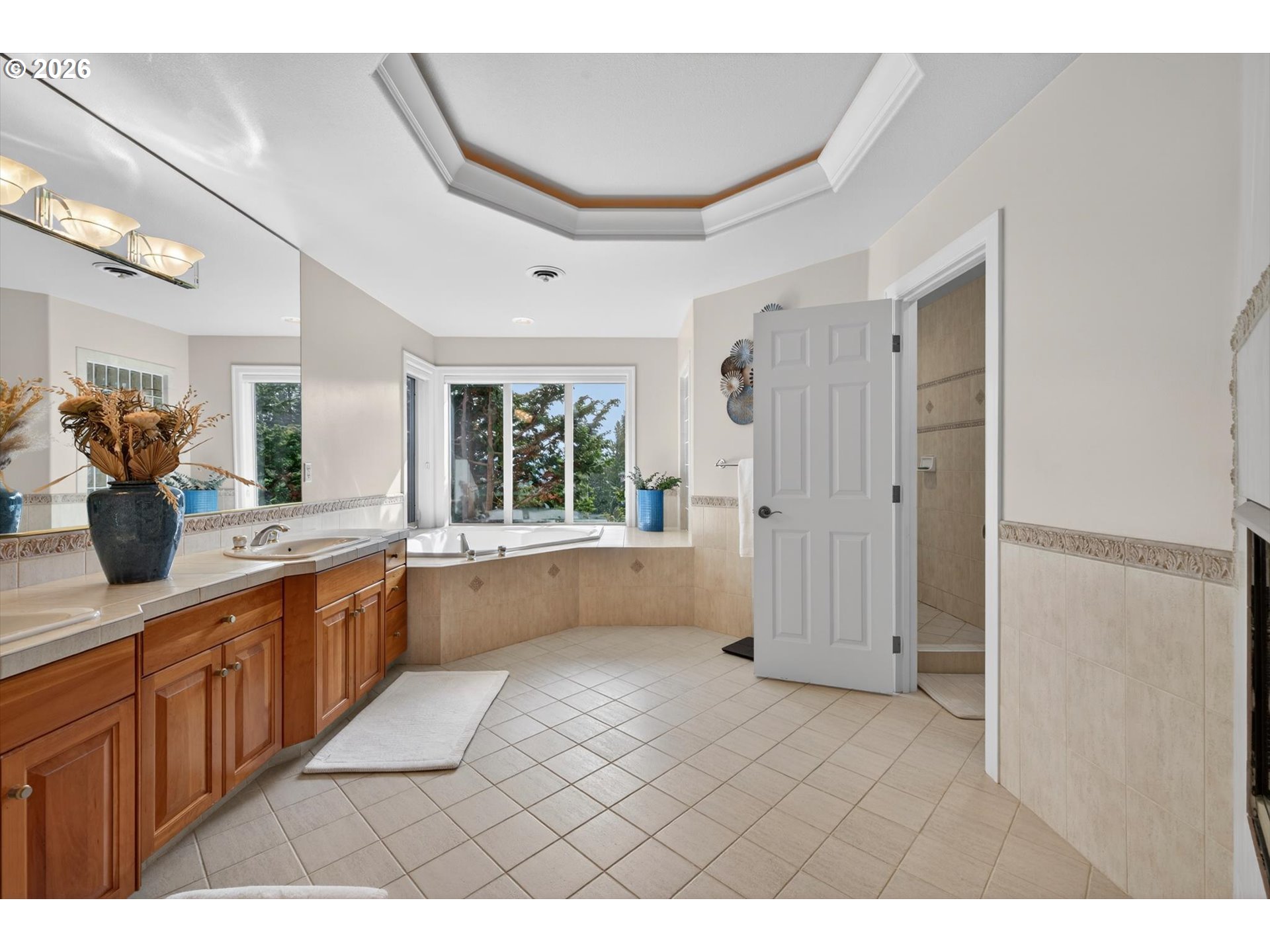 3390 Quail Ridge Court West Linn, OR 97068 - Photo 28 of 48 a large bathroom with a double vanity sink a large mirror and shower