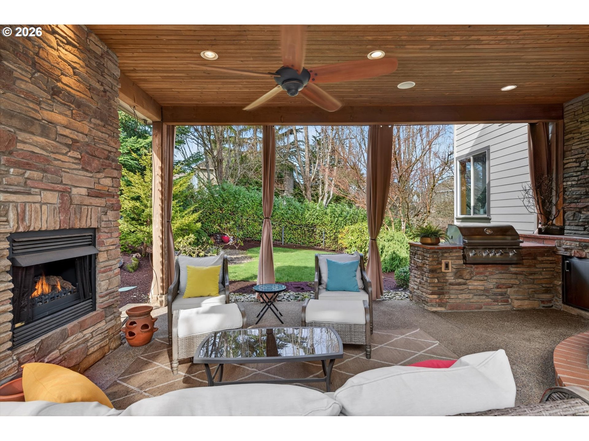 3390 Quail Ridge Court West Linn, OR 97068 - Photo 38 of 48 a living room with patio furniture and a fireplace