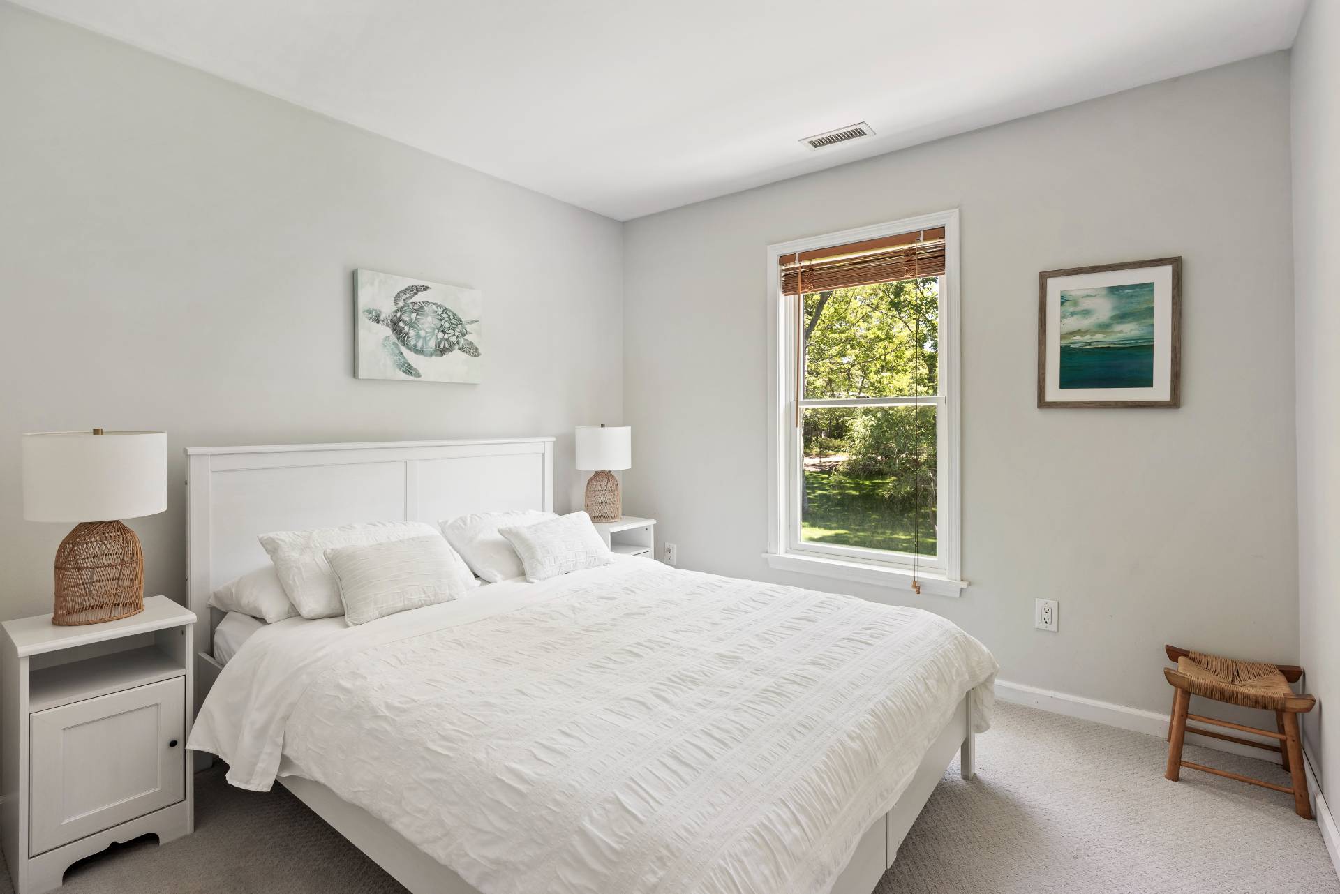 344 Accabonac Road East Hampton, NY 11937 - Photo 20 of 28 a bedroom with a bed and a window