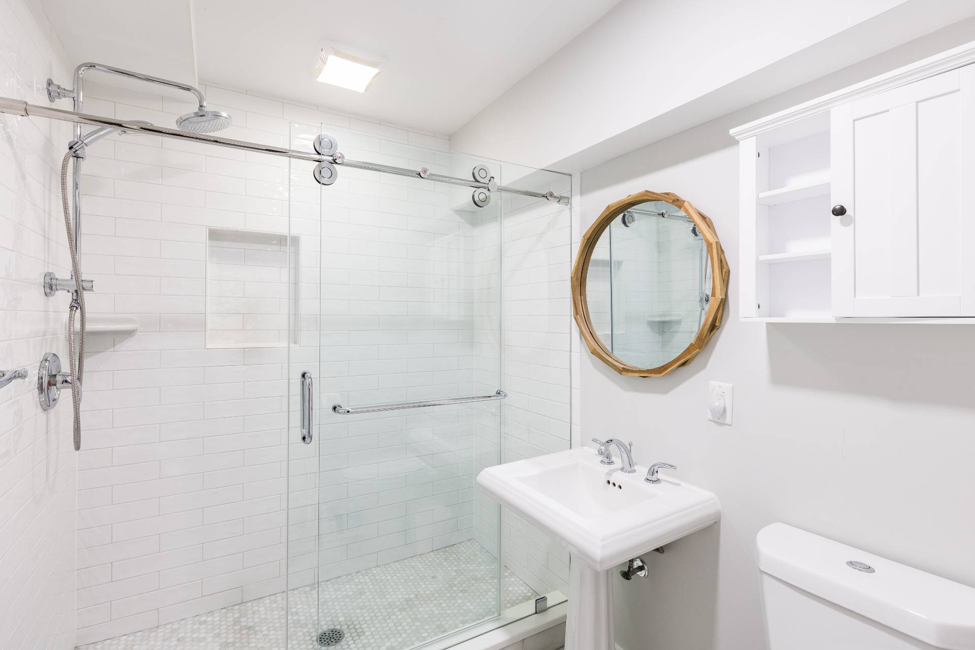 344 Accabonac Road East Hampton, NY 11937 - Photo 25 of 28 a bathroom with a sink mirror toilet and shower