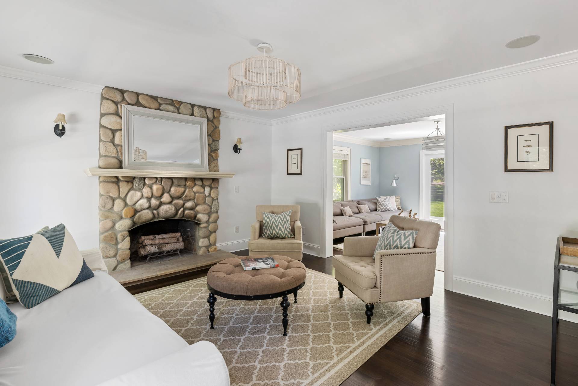 344 Accabonac Road East Hampton, NY 11937 - Photo 10 of 28 a living room with furniture a table and a fireplace