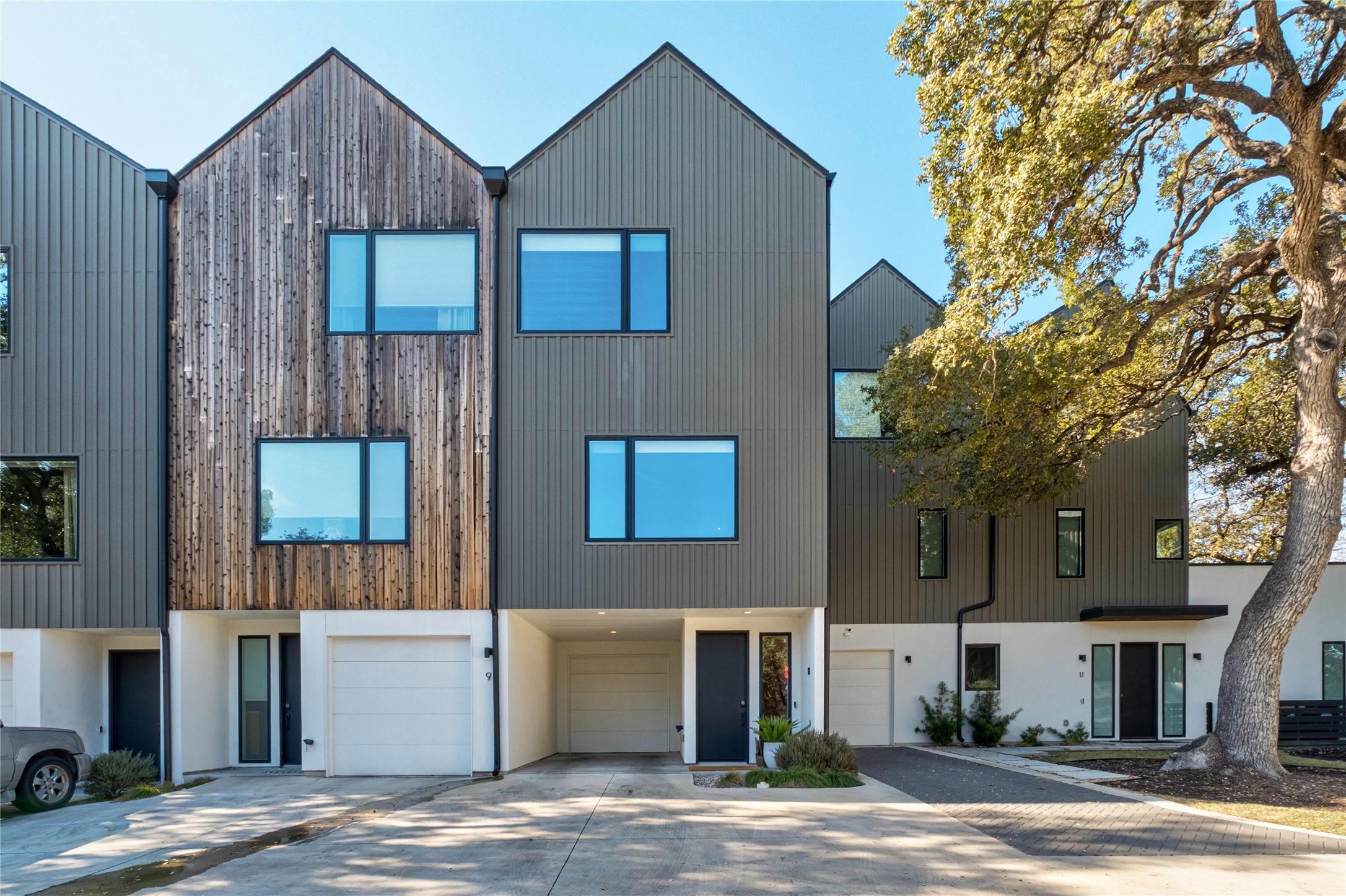 a view of a house with a yard and garage