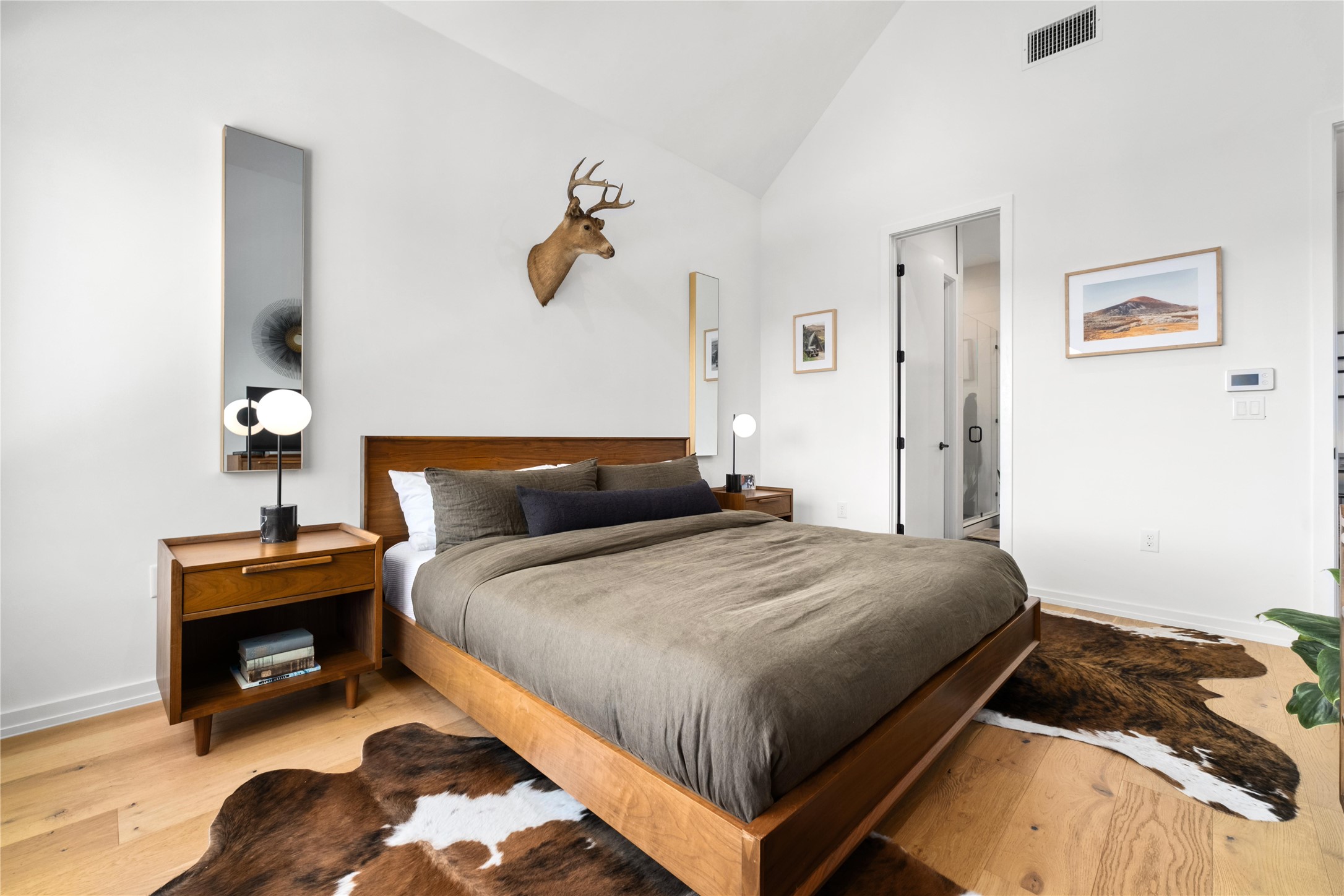 410 West Alpine Road, Unit 10 Austin, TX 78704 - Photo 14 of 31 a bedroom with a bed and a fireplace