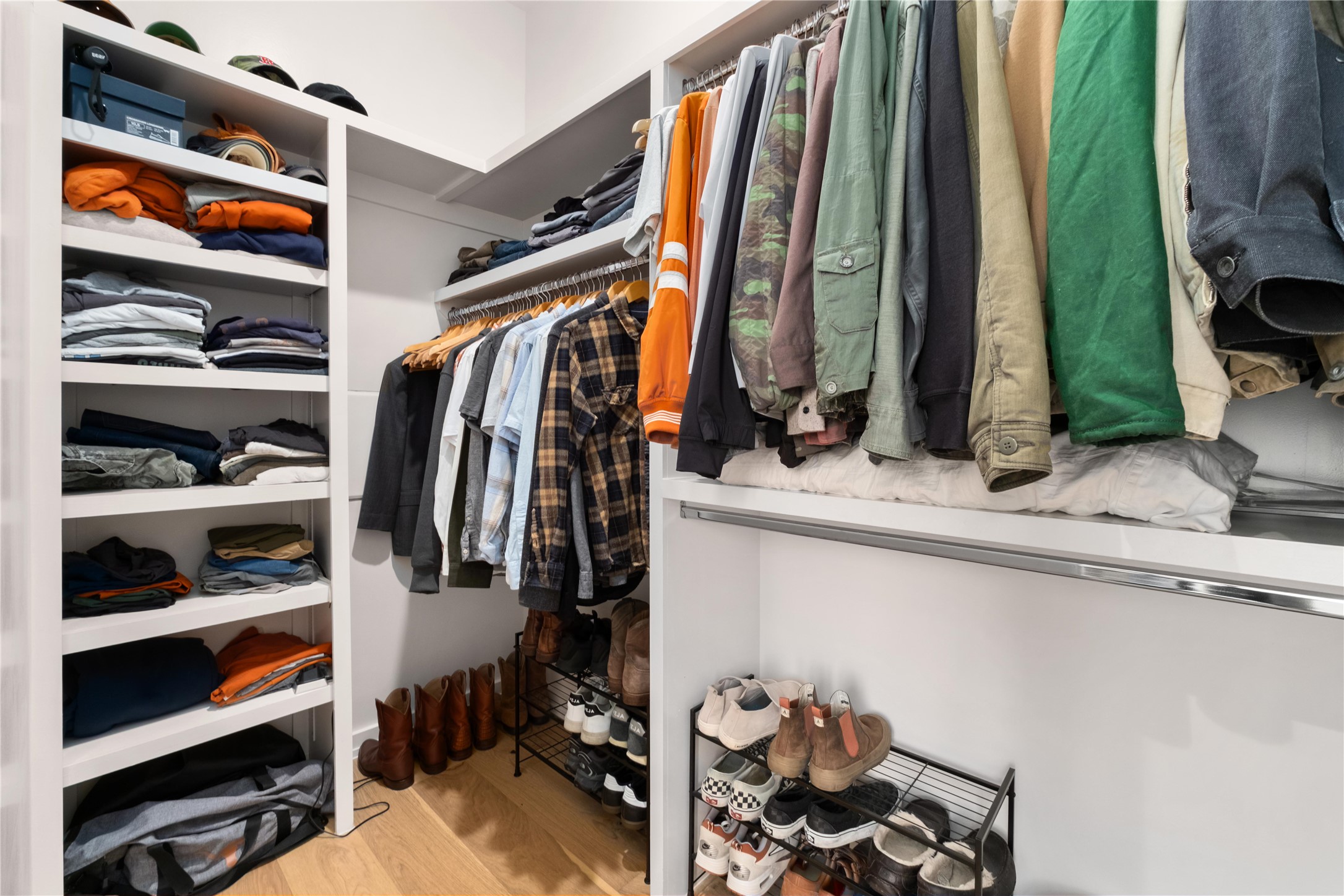 410 West Alpine Road, Unit 10 Austin, TX 78704 - Photo 19 of 31 a view of walk in closet with clothes and shoes