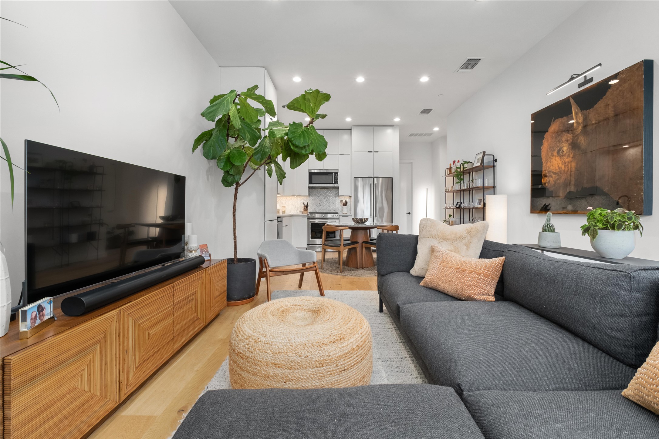 410 West Alpine Road, Unit 10 Austin, TX 78704 - Photo 7 of 31 a living room with furniture and a flat screen tv
