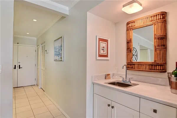 a kitchen with a sink dishwasher a stove and cabinets