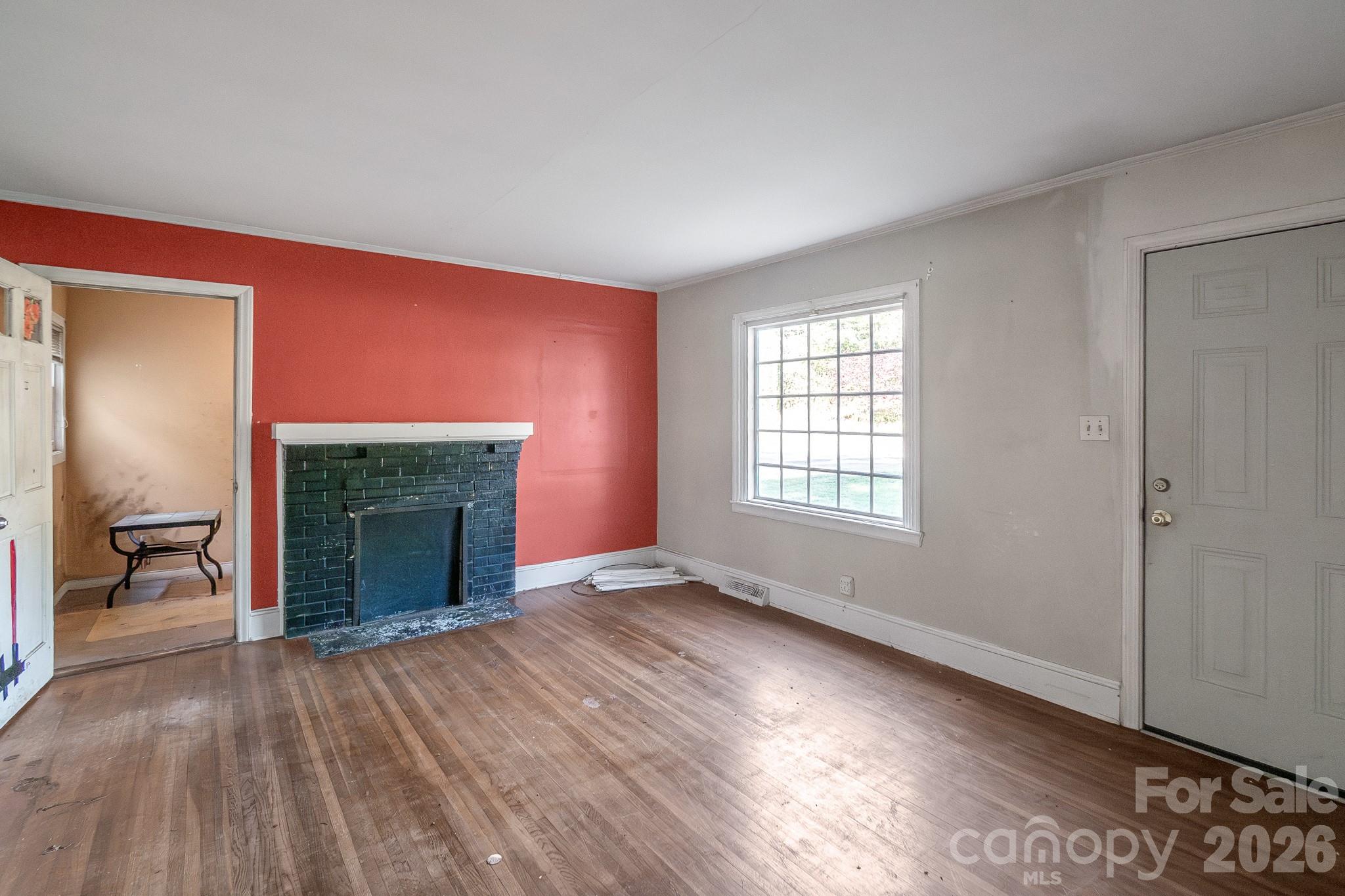 4430 West Tyvola Road Charlotte, NC 28208 - Photo 11 of 33 wooden floor fireplace and windows in an empty room