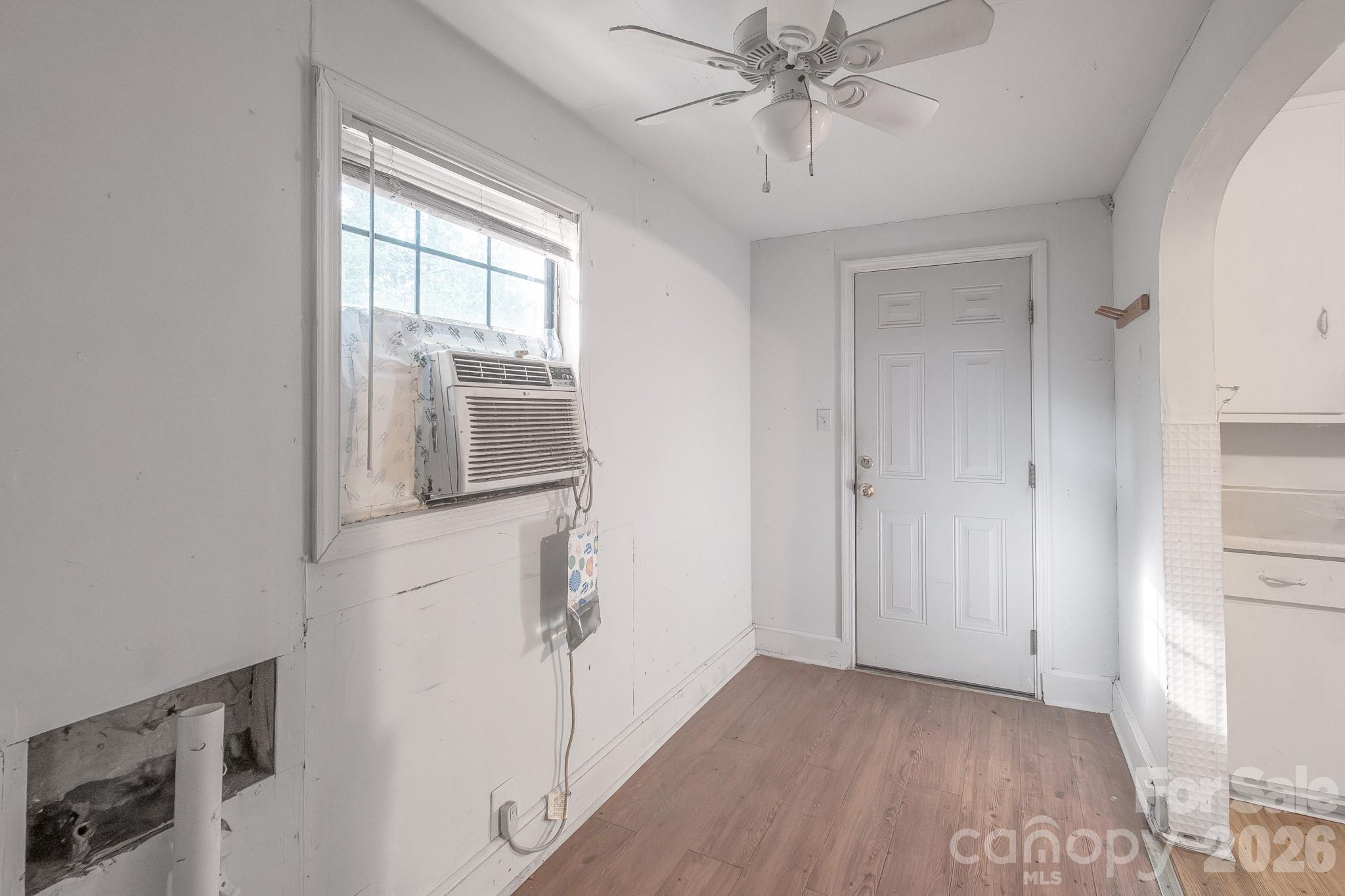 4430 West Tyvola Road Charlotte, NC 28208 - Photo 18 of 33 a view of a livingroom with an empty space and a window