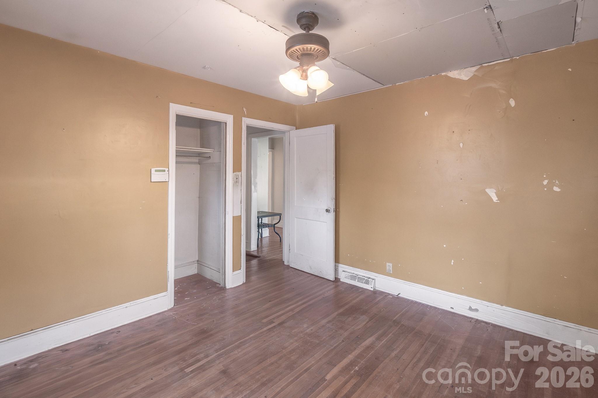 4430 West Tyvola Road Charlotte, NC 28208 - Photo 21 of 33 a view of an empty room with wooden floor