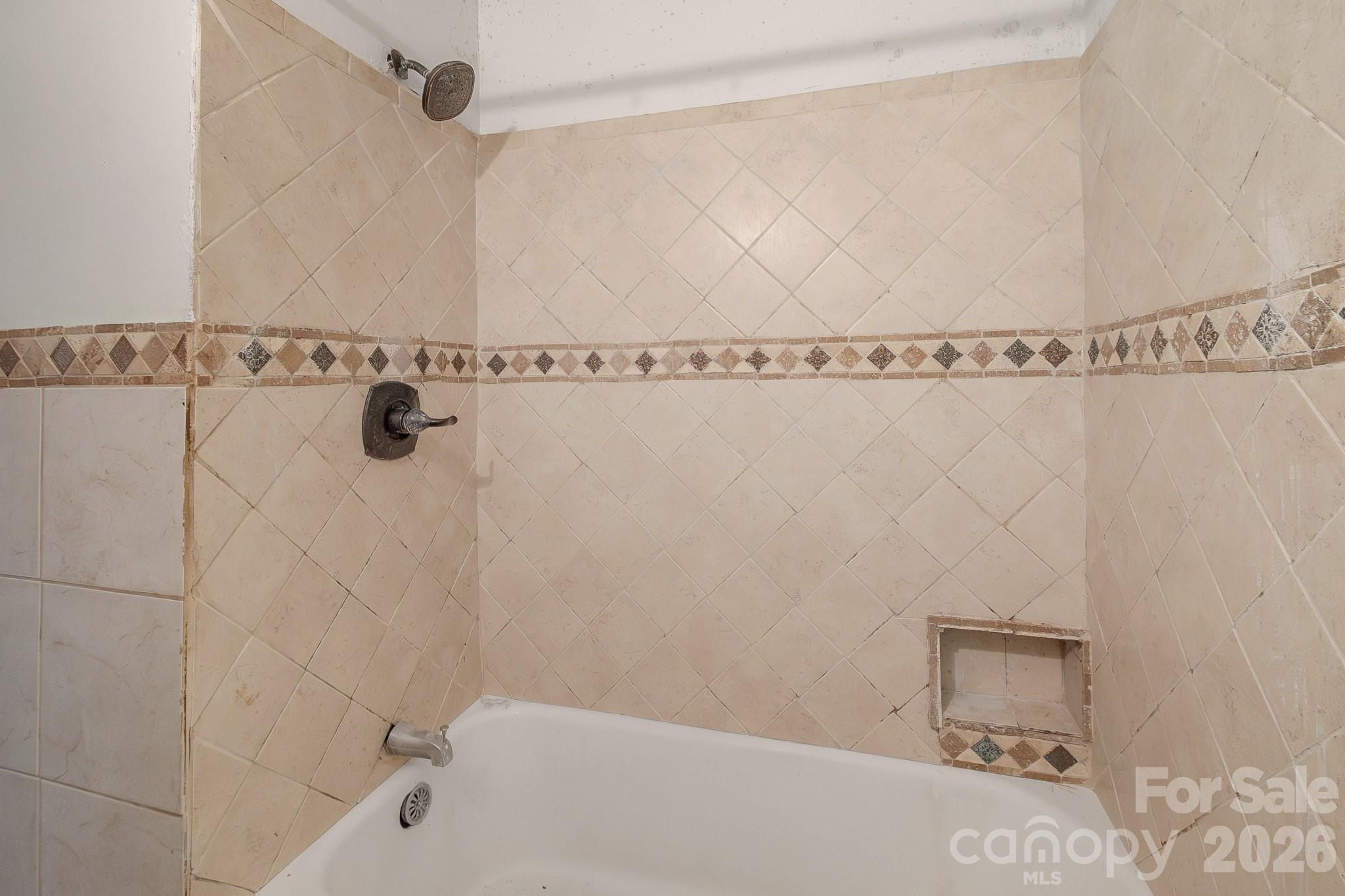 4430 West Tyvola Road Charlotte, NC 28208 - Photo 26 of 33 a bathroom with a bathtub and a shower