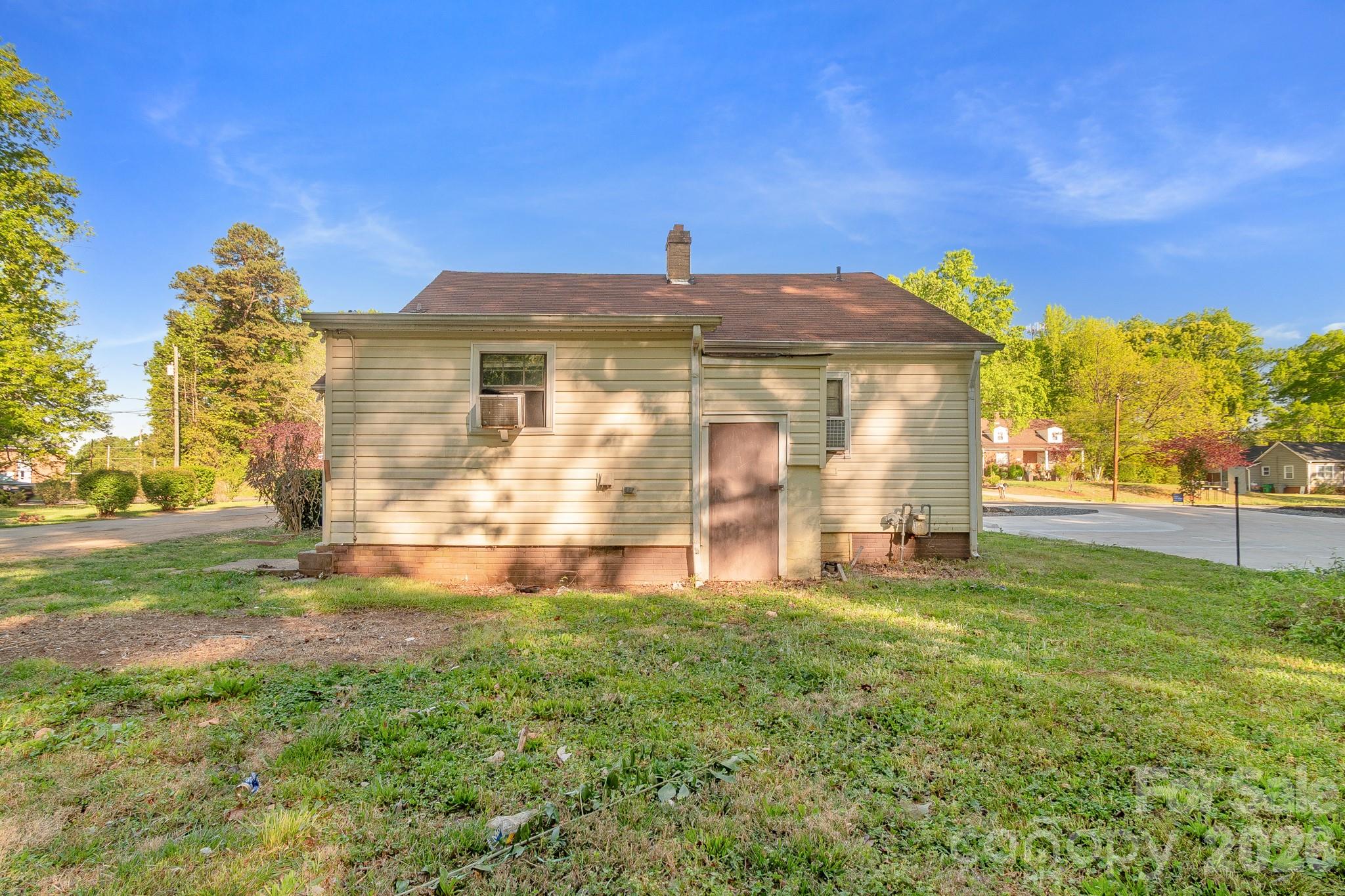 4430 West Tyvola Road Charlotte, NC 28208 - Photo 29 of 33 a front view of a house with a yard