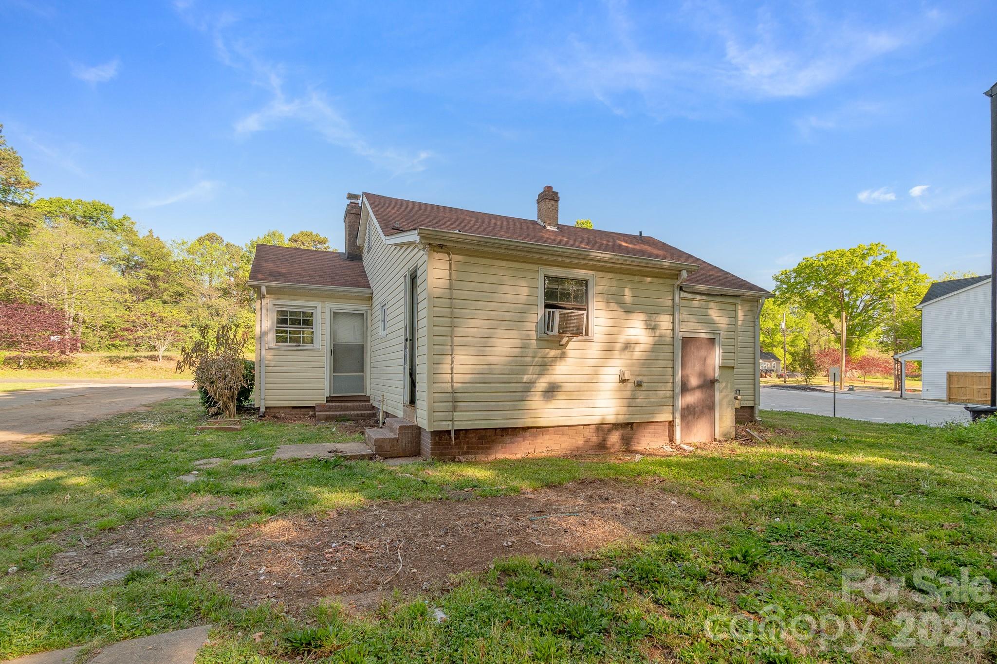 4430 West Tyvola Road Charlotte, NC 28208 - Photo 30 of 33 a view of a house with backyard