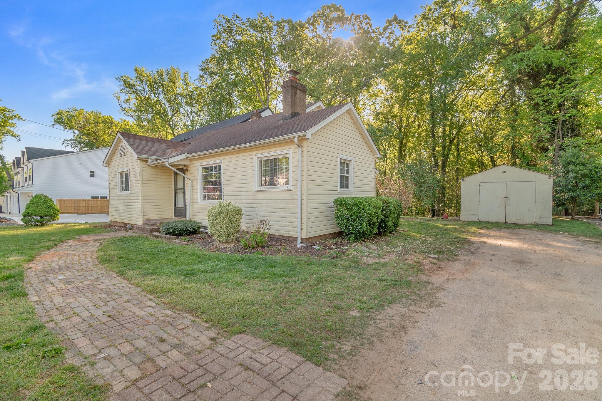 4430 West Tyvola Road Charlotte, NC 28208 - Photo 3 of 33 a view of a house with a yard