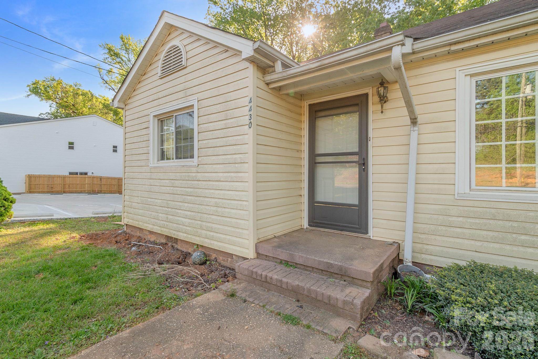 4430 West Tyvola Road Charlotte, NC 28208 - Photo 4 of 33 a view of a house with a yard