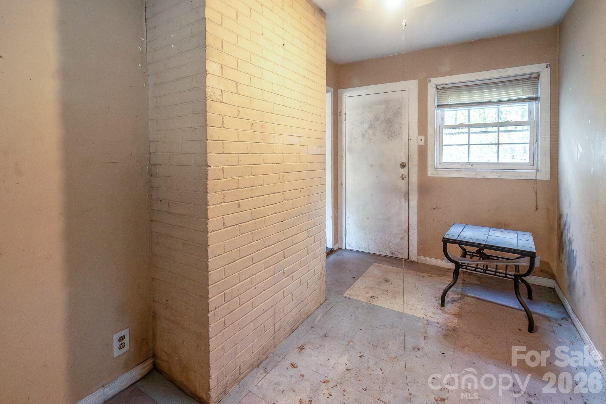 4430 West Tyvola Road Charlotte, NC 28208 - Photo 7 of 33 a view of a bedroom with furniture and a window