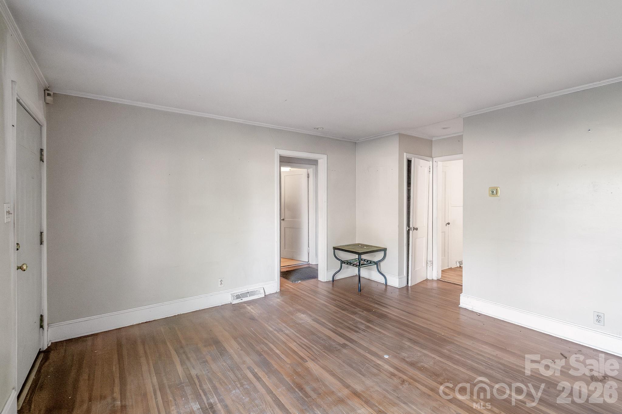 4430 West Tyvola Road Charlotte, NC 28208 - Photo 9 of 33 a view of empty room with wooden floor