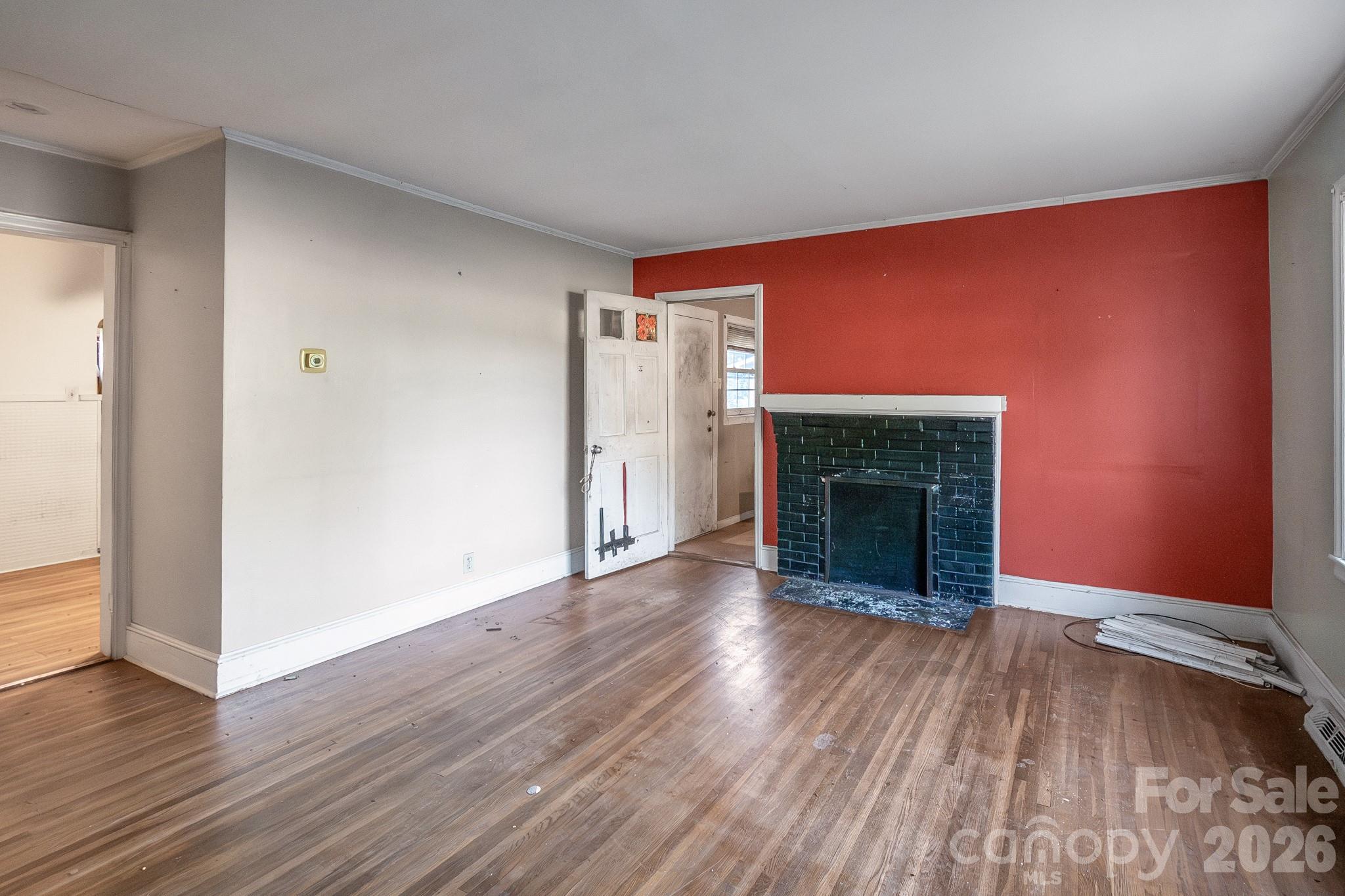 4430 West Tyvola Road Charlotte, NC 28208 - Photo 10 of 33 wooden floor fireplace and natural light in room