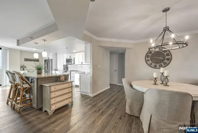 a bathroom with a granite countertop sink toilet mirror and shower