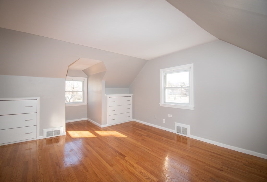 24 Lumae Street Springfield, MA 01119 - Photo 11 of 33 wooden floor in an empty room with a window