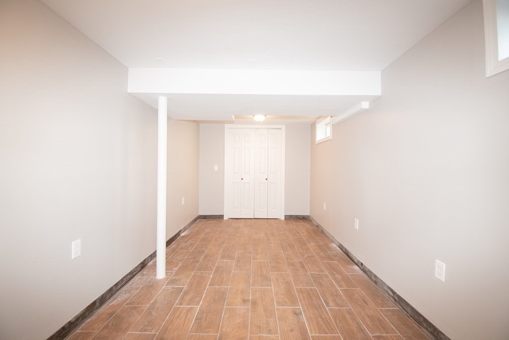 24 Lumae Street Springfield, MA 01119 - Photo 16 of 33 a view of empty room with wooden floor