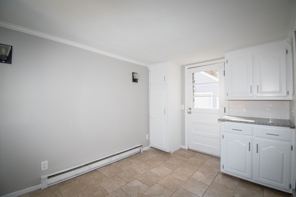 24 Lumae Street Springfield, MA 01119 - Photo 24 of 33 an empty room with white cabinets