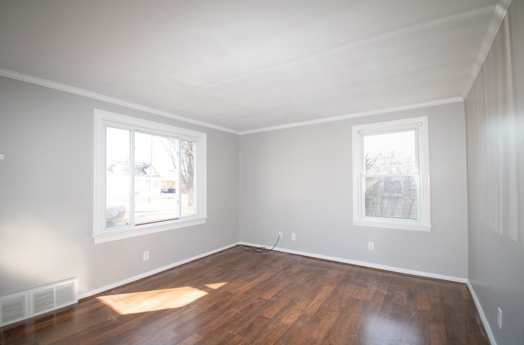24 Lumae Street Springfield, MA 01119 - Photo 26 of 33 an empty room with wooden floor and windows