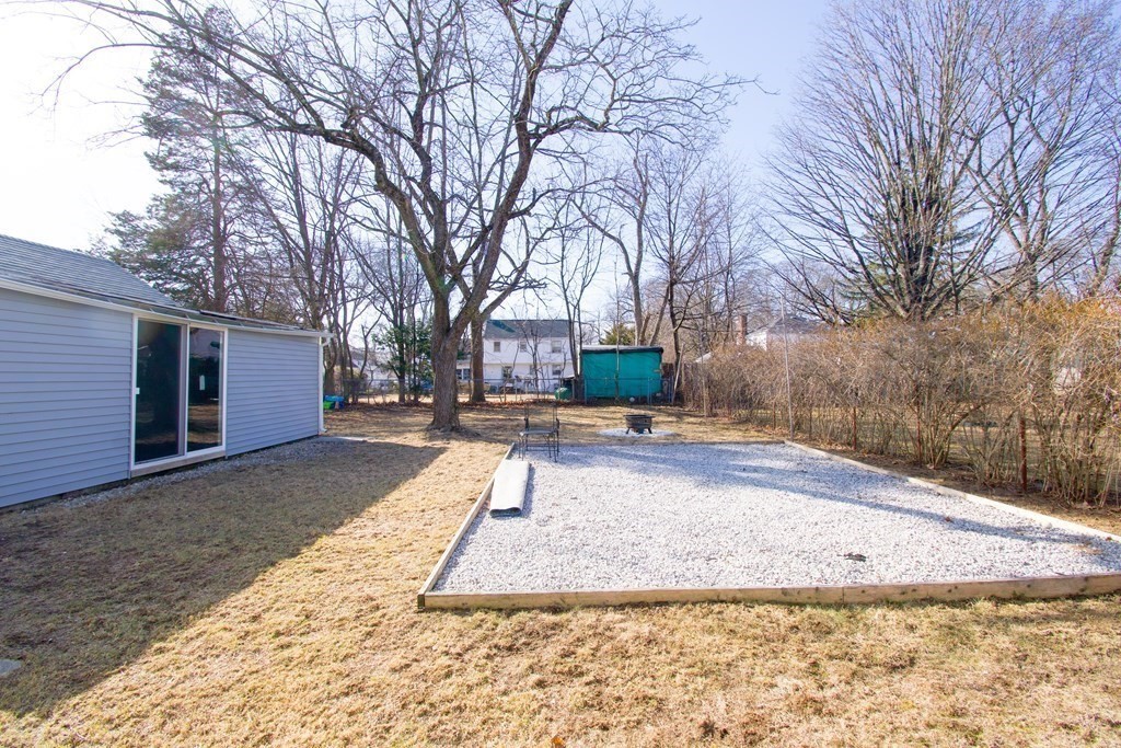 24 Lumae Street Springfield, MA 01119 - Photo 3 of 33 a view of a yard with a house and trees