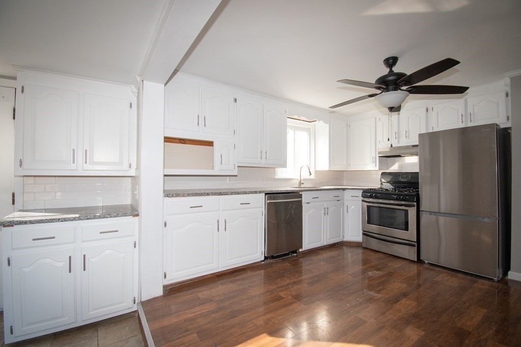 24 Lumae Street Springfield, MA 01119 - Photo 33 of 33 a kitchen with a refrigerator sink and cabinets