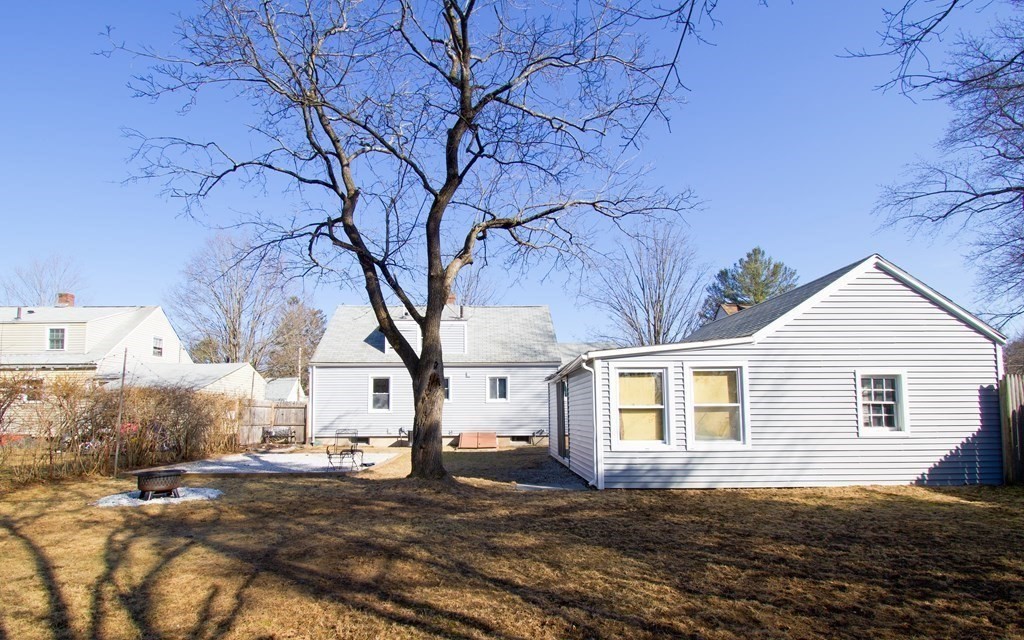 24 Lumae Street Springfield, MA 01119 - Photo 5 of 33 a view of a yard with a house and a tree