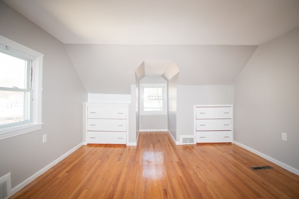 24 Lumae Street Springfield, MA 01119 - Photo 8 of 33 wooden floor in an empty room with a window