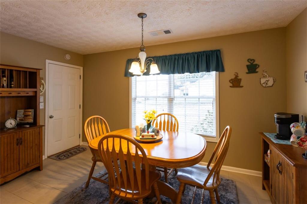 164 Laurel Lane Social Circle, GA 30025 - Photo 14 of 38 a view of a dining room with furniture window and outside view
