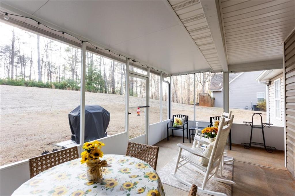 164 Laurel Lane Social Circle, GA 30025 - Photo 32 of 38 a dining room with furniture a chandelier and wooden floor