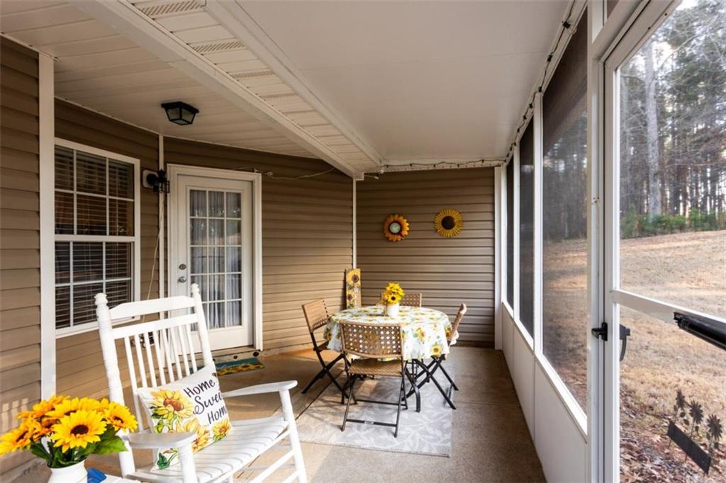 164 Laurel Lane Social Circle, GA 30025 - Photo 34 of 38 a porch with a bench