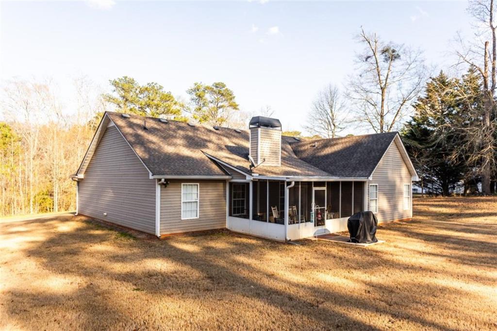 164 Laurel Lane Social Circle, GA 30025 - Photo 35 of 38 a front view of a house with a yard and garage