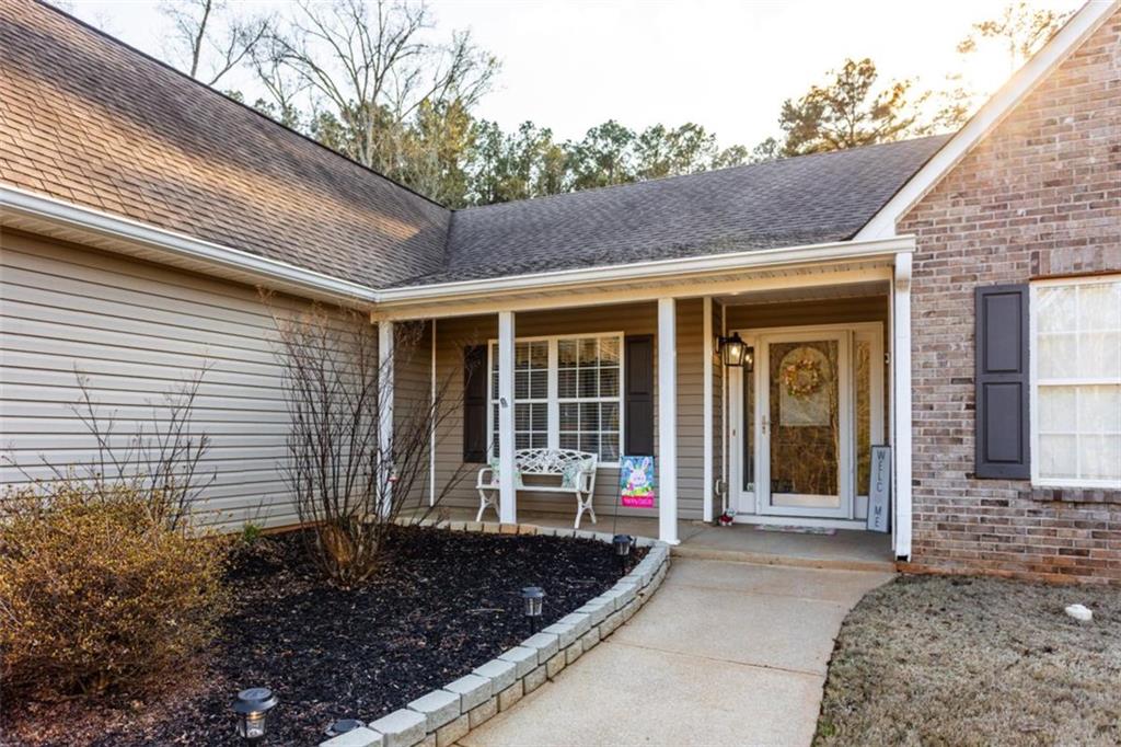 164 Laurel Lane Social Circle, GA 30025 - Photo 38 of 38 a front view of a house with garden