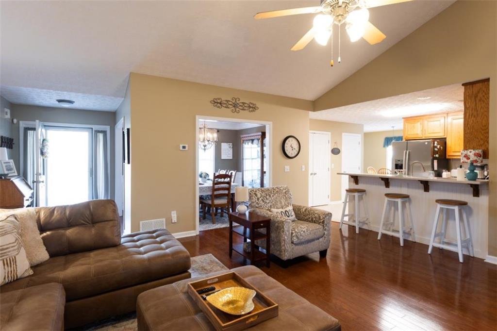 164 Laurel Lane Social Circle, GA 30025 - Photo 6 of 38 a living room with furniture and a chandelier