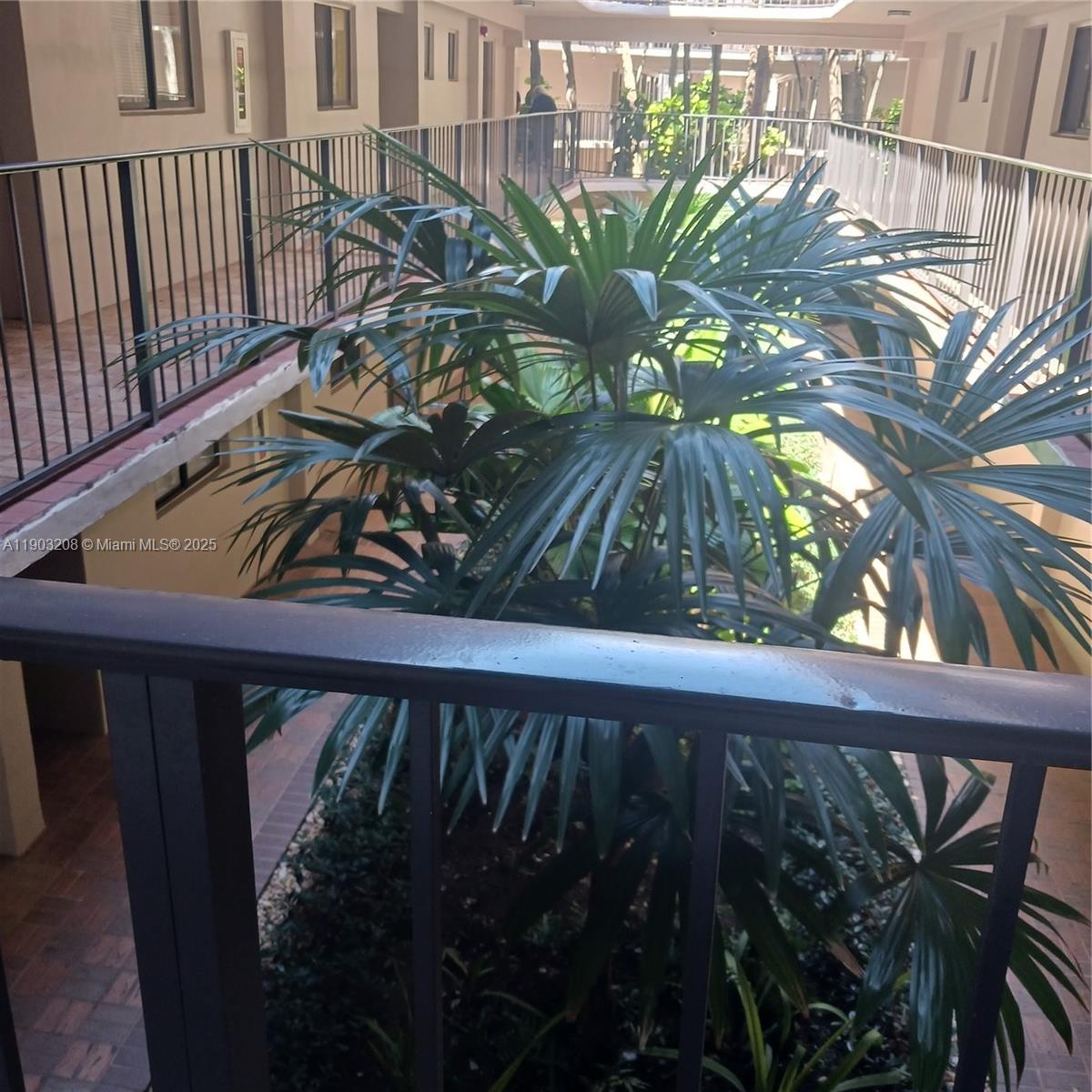 8650 Southwest 133rd Avenue Road, Unit 208 Miami, FL 33183 - Photo 3 of 10 a view of a balcony with wooden floor