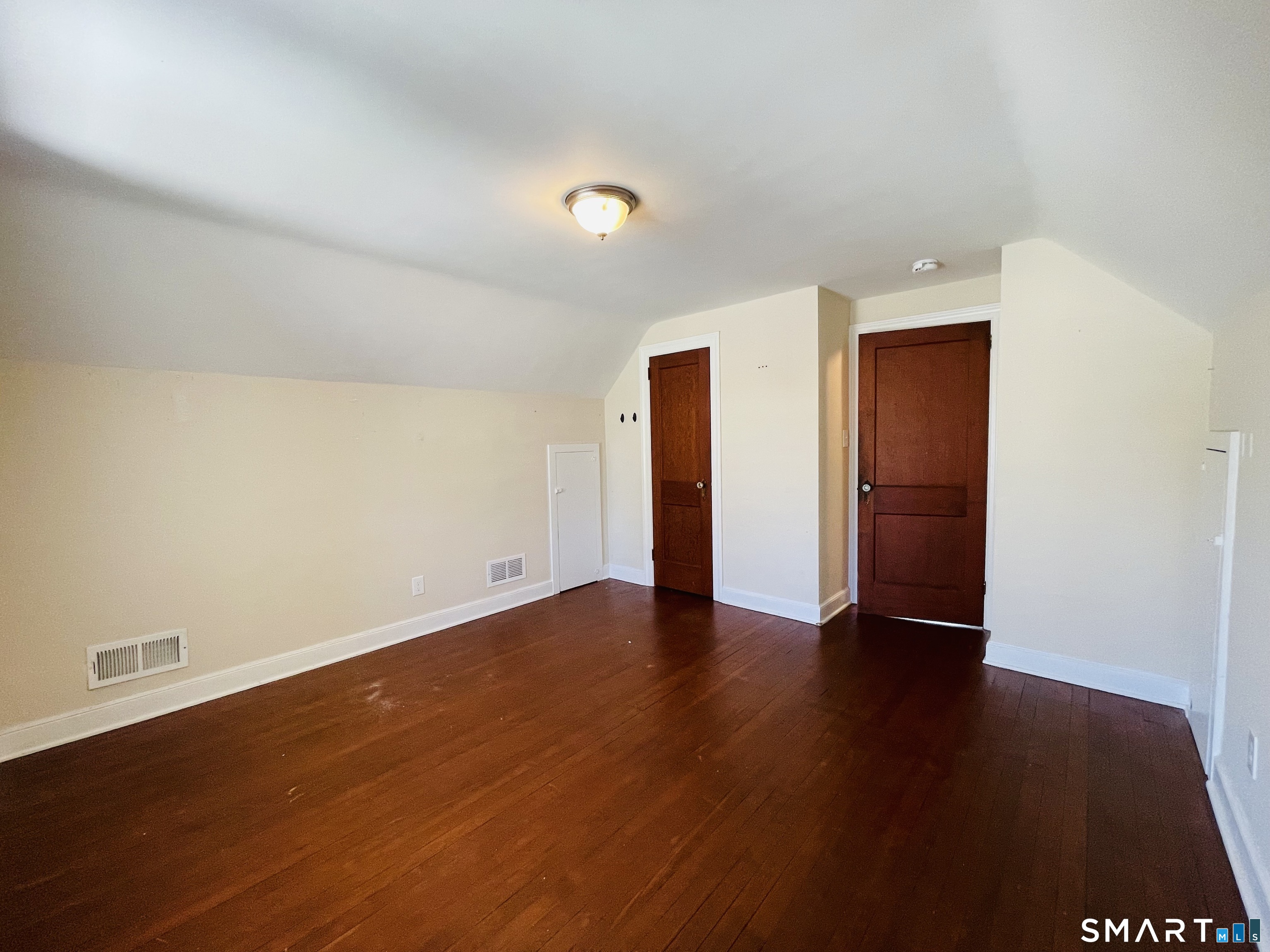 194 Washington Avenue Torrington, CT 06790 - Photo 4 of 7 a view of an empty room with wooden floor