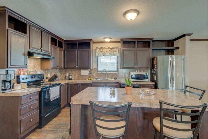 2800 Lock Hollow Road Dickson, TN 37055 - Photo 11 of 26 a kitchen with kitchen island a sink stove and refrigerator
