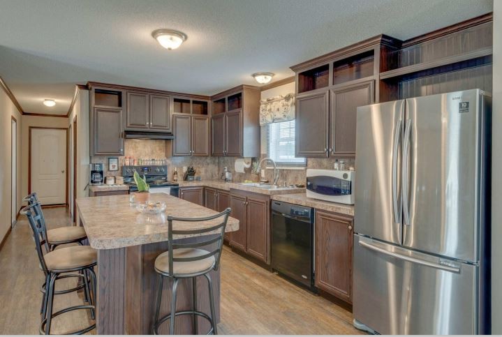 2800 Lock Hollow Road Dickson, TN 37055 - Photo 12 of 26 a kitchen with kitchen island a appliances a counter space and a refrigerator