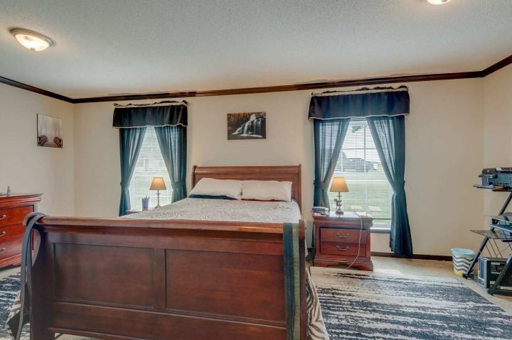 2800 Lock Hollow Road Dickson, TN 37055 - Photo 14 of 26 a bedroom with a bed and a mirror