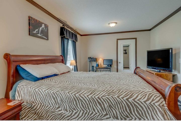 2800 Lock Hollow Road Dickson, TN 37055 - Photo 15 of 26 a bedroom with a bed and a flat screen tv