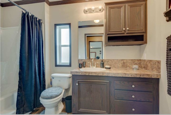 2800 Lock Hollow Road Dickson, TN 37055 - Photo 18 of 26 a bathroom with a granite countertop sink and a toilet
