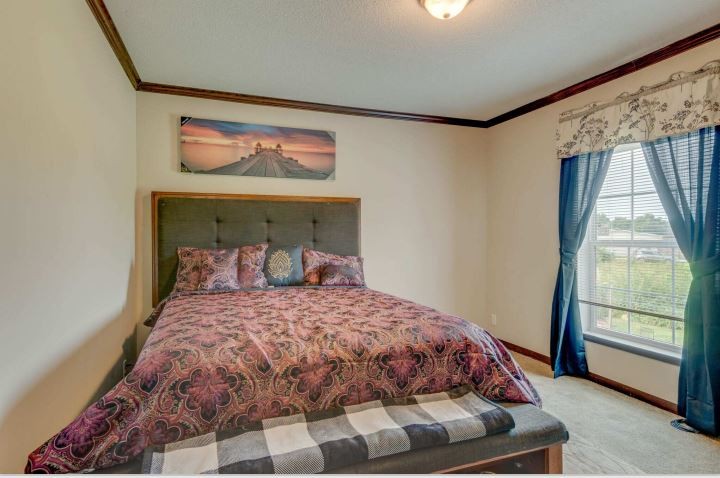 2800 Lock Hollow Road Dickson, TN 37055 - Photo 19 of 26 a bedroom with a bed and a window