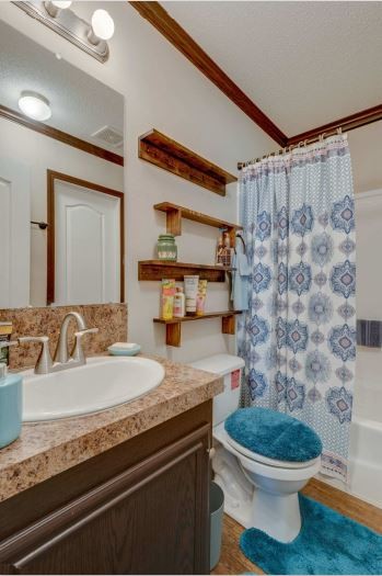 2800 Lock Hollow Road Dickson, TN 37055 - Photo 20 of 26 a bathroom with a granite countertop sink toilet and a mirror