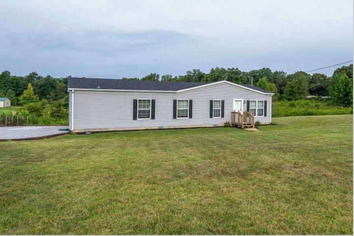 2800 Lock Hollow Road Dickson, TN 37055 - Photo 3 of 26 a front view of a house with garden