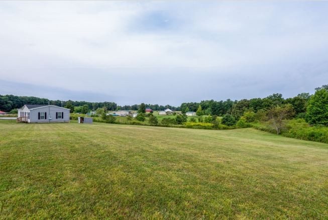 2800 Lock Hollow Road Dickson, TN 37055 - Photo 22 of 26 a view of a green field with houses in back