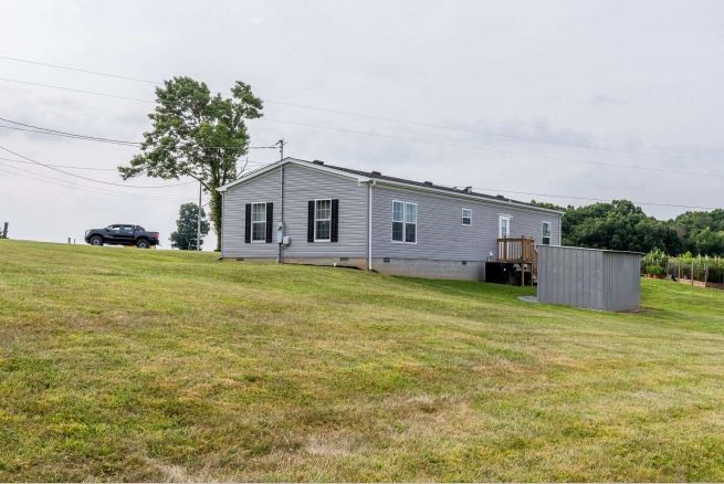 2800 Lock Hollow Road Dickson, TN 37055 - Photo 24 of 26 a view of a house with a yard and sitting area