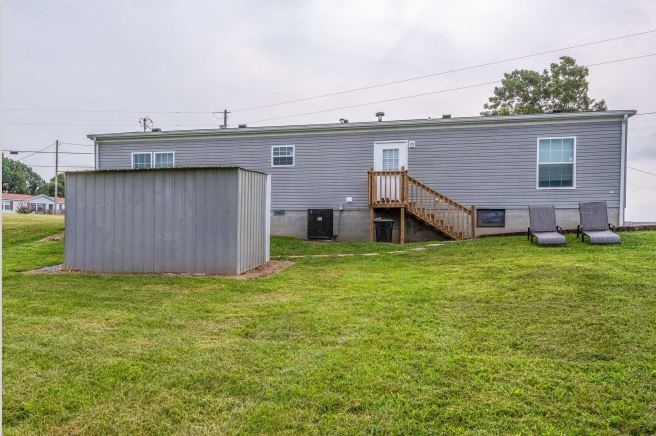 2800 Lock Hollow Road Dickson, TN 37055 - Photo 25 of 26 a view of a house with a yard and sitting area